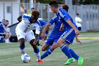 GORIZIA, ITALY - AUGUST 24:  Bioty Moise Kean (L) of Italy U16 in action during the International Friendly between Italy U16 and Bosnia U16 at Stadio Enzo Bearzot on August 24, 2016 in Gorizia, Italy.  (Photo by Dino Panato/Getty Images)