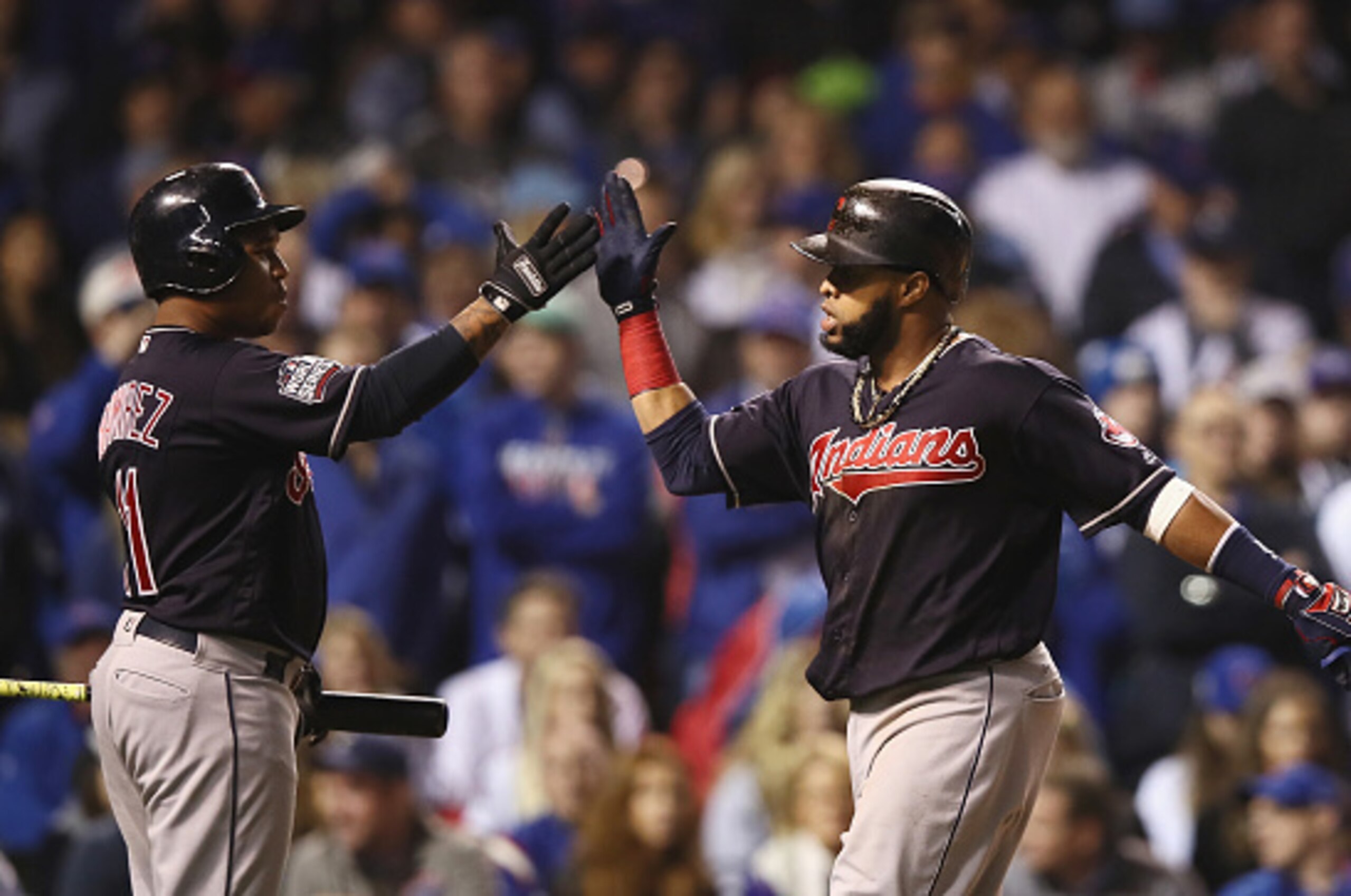 CHICAGO, IL - OCTOBER 29:  Jose Ramirez #11 of the Cleveland Indians congratulates Carlos Santana #41 after Santana hit a home run in the first inning against the Chicago Cubs in Game Four of the 2016 World Series at Wrigley Field on October 29, 2016 in C