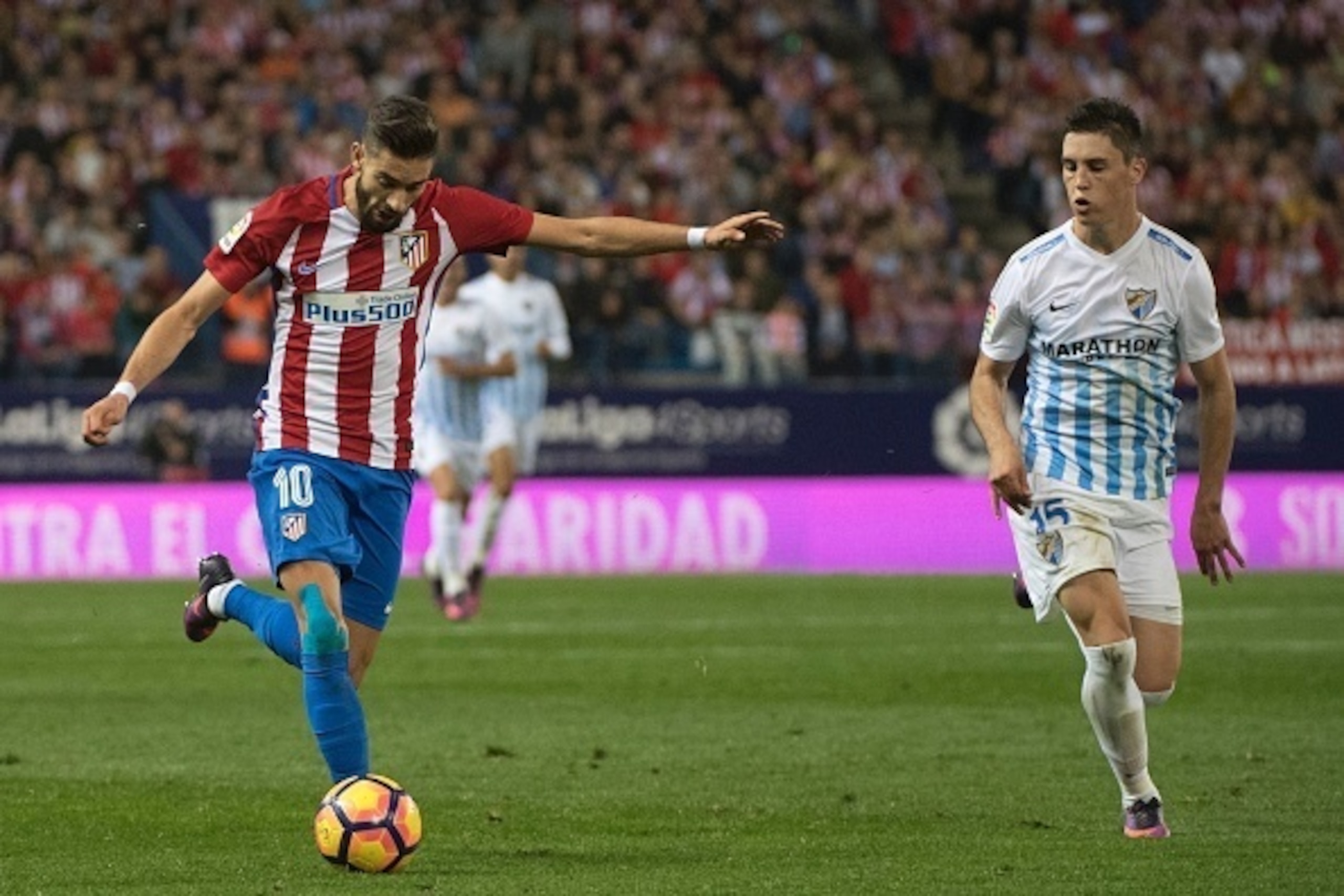 Atletico Madrid's Belgian midfielder Yannick Ferreira Carrasco scores during the Spanish league football match between Club Atletico de Madrid and Malaga CF at the Vicente Calderon stadium in Madrid on October 29, 2016. / AFP / CURTO DE LA TORRE        (P
