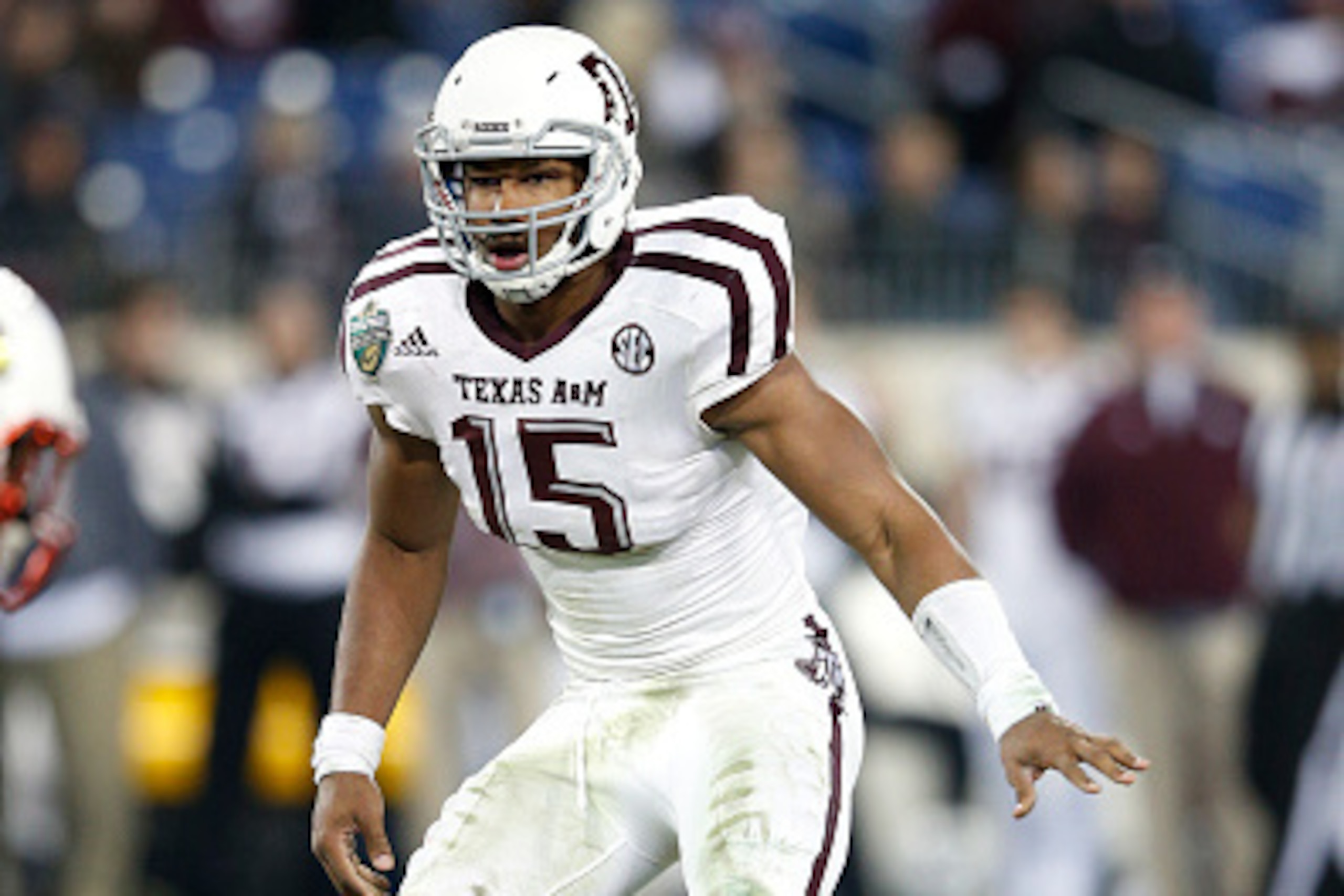 NASHVILLE, TN - DECEMBER 30: Myles Garrett #15 of the Texas A&M Aggies in action against the Louisville Cardinals during the Franklin American Mortgage Music City Bowl at Nissan Stadium on December 30, 2015 in Nashville, Tennessee. Louisville defeated Tex NASHVILLE, TN - DECEMBER 30: Myles Garrett #15 of the Texas A&M Aggies in action against the Louisville Cardinals during the Franklin American Mortgage Music City Bowl at Nissan Stadium on December 30, 2015 in Nashville, Tennessee. Louisville defeated Tex