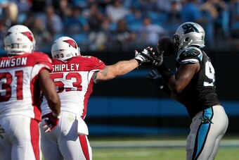 CHARLOTTE, NC - OCTOBER 30:  Kony Ealy #94 of the Carolina Panthers grabs an interception in the 4th quarter against the Arizona Cardinals during their game at Bank of America Stadium on October 30, 2016 in Charlotte, North Carolina.  (Photo by Streeter L