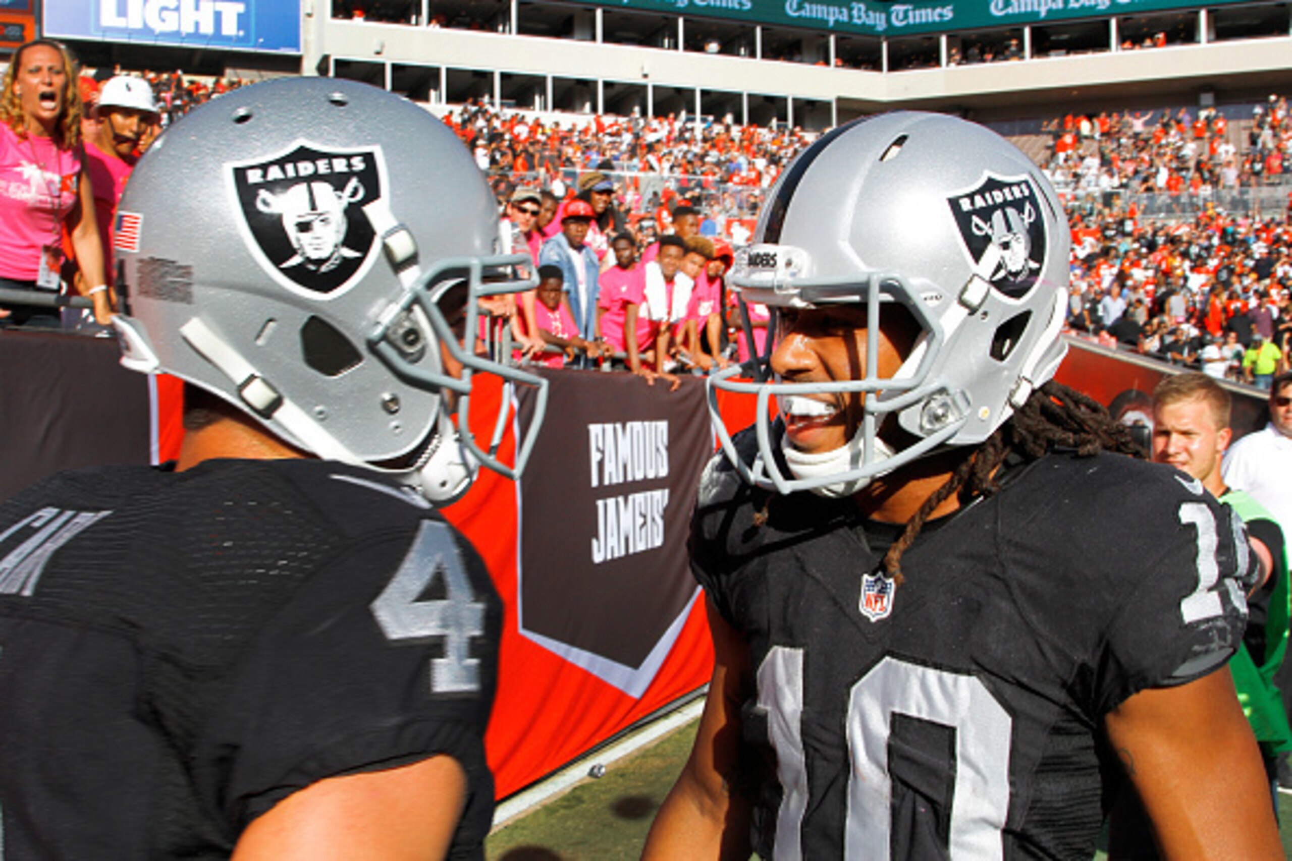 TAMPA, FL - OCTOBER 30: Quarterback Derek Carr #4 of the Oakland Raiders and wide receiver Seth Roberts #10 celebrate in the back of the end zone after connecting on the winning touchdown in overtime against the Tampa Bay Buccaneers at Raymond James Stad TAMPA, FL - OCTOBER 30: Quarterback Derek Carr #4 of the Oakland Raiders and wide receiver Seth Roberts #10 celebrate in the back of the end zone after connecting on the winning touchdown in overtime against the Tampa Bay Buccaneers at Raymond James Stad