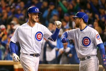 Oct 30, 2016; Chicago, IL, USA; Chicago Cubs third baseman Kris Bryant (left) is congratulated by left fielder Ben Zobrist (right) for hitting a solo home run against the Cleveland Indians during the fourth inning in game five of the 2016 World Series at