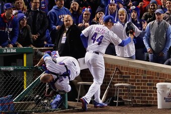 CHICAGO, IL - OCTOBER 30:  Anthony Rizzo #44 of the Chicago Cubs (R) catches a foul ball next to David Ross #3 in the second inning against the Cleveland Indians in Game Five of the 2016 World Series at Wrigley Field on October 30, 2016 in Chicago, Illino