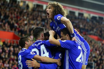SOUTHAMPTON, ENGLAND - OCTOBER 30: David Luiz of Chelsea jumps up as Diego Costa of Chelsea celebrates scoring to make it 0-2 during the Premier League match between Southampton and Chelsea at St Mary's Stadium on October 30, 2016 in Southampton, England.