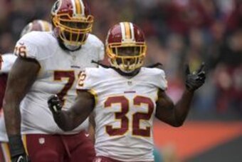 Oct 30, 2016; London, United Kingdom; Washington Redskins running back Robert Kelley (32) celebrates with tackle Morgan Moses (76) after scoring on a four-yard touchdown run in the first quarter against the Cincinnati Bengals during game 17 of the NFL Int