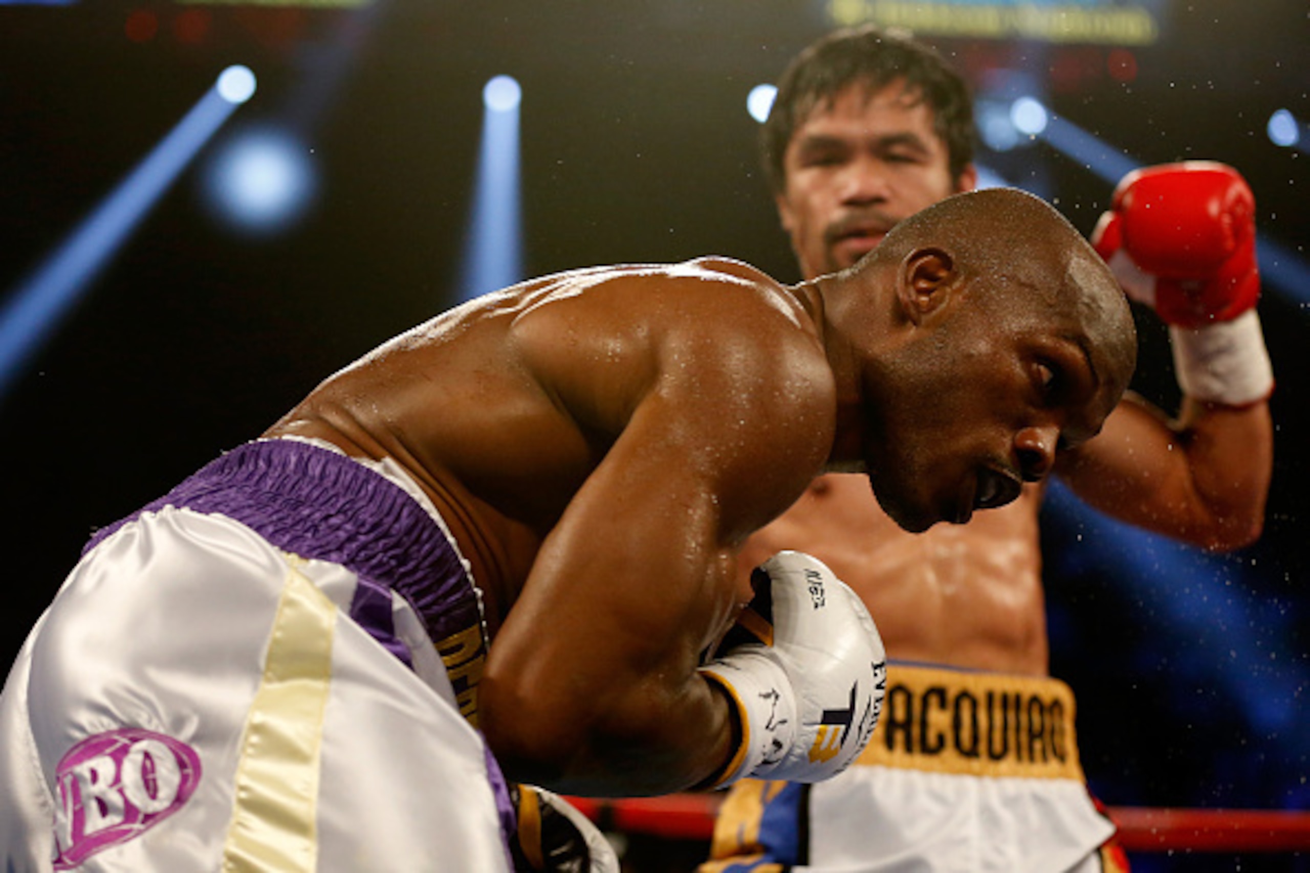 LAS VEGAS, NEVADA - APRIL 09:  Timothy Bradley Jr. (L) gets punched by Manny Pacquiao during their welterweight championship fight on April 9, 2016 at MGM Grand Garden Arena in Las Vegas, Nevada. Pacquiao won by unanimous decision.  (Photo by Christian Pe