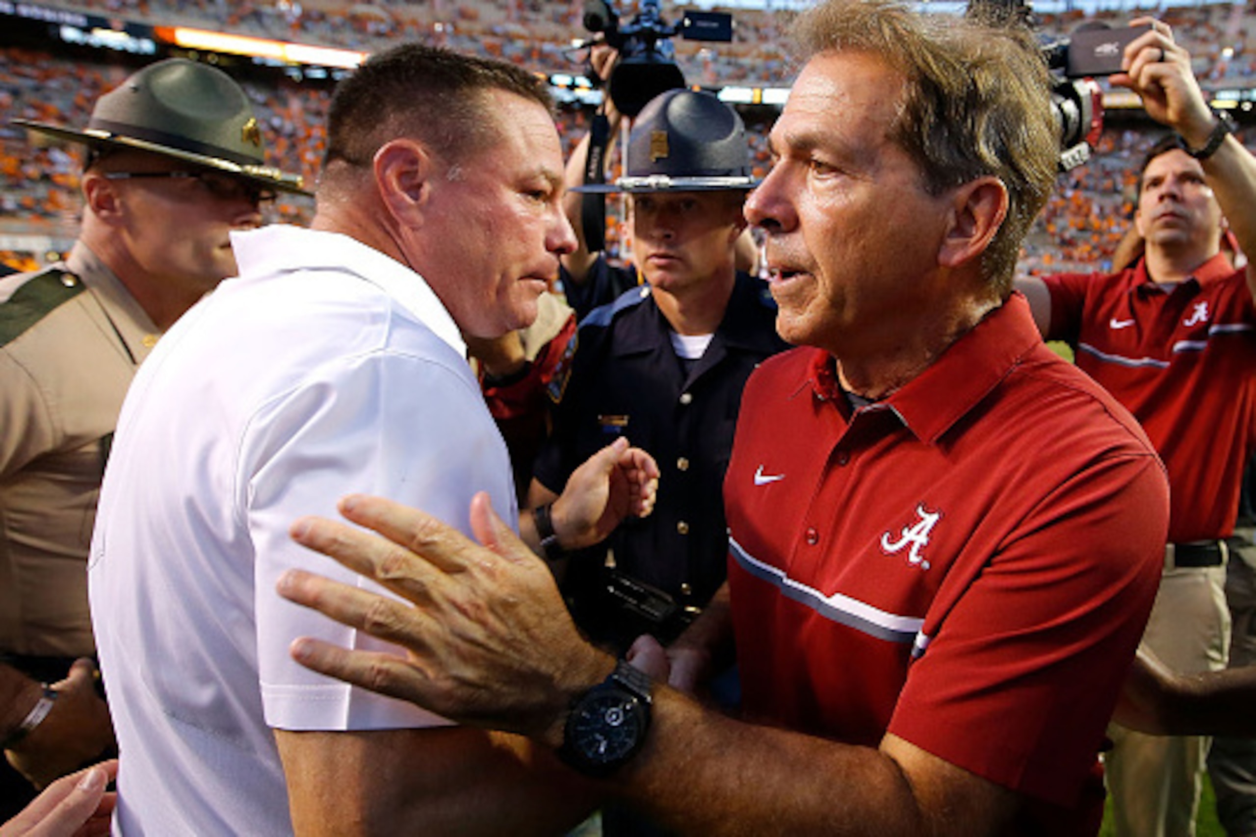 KNOXVILLE, TN - OCTOBER 15:  Head coach Nick Saban of the Alabama Crimson Tide shakes hands with head coach Butch Jones of the Tennessee Volunteers after their 49-10 win at Neyland Stadium on October 15, 2016 in Knoxville, Tennessee.  (Photo by Kevin C. C