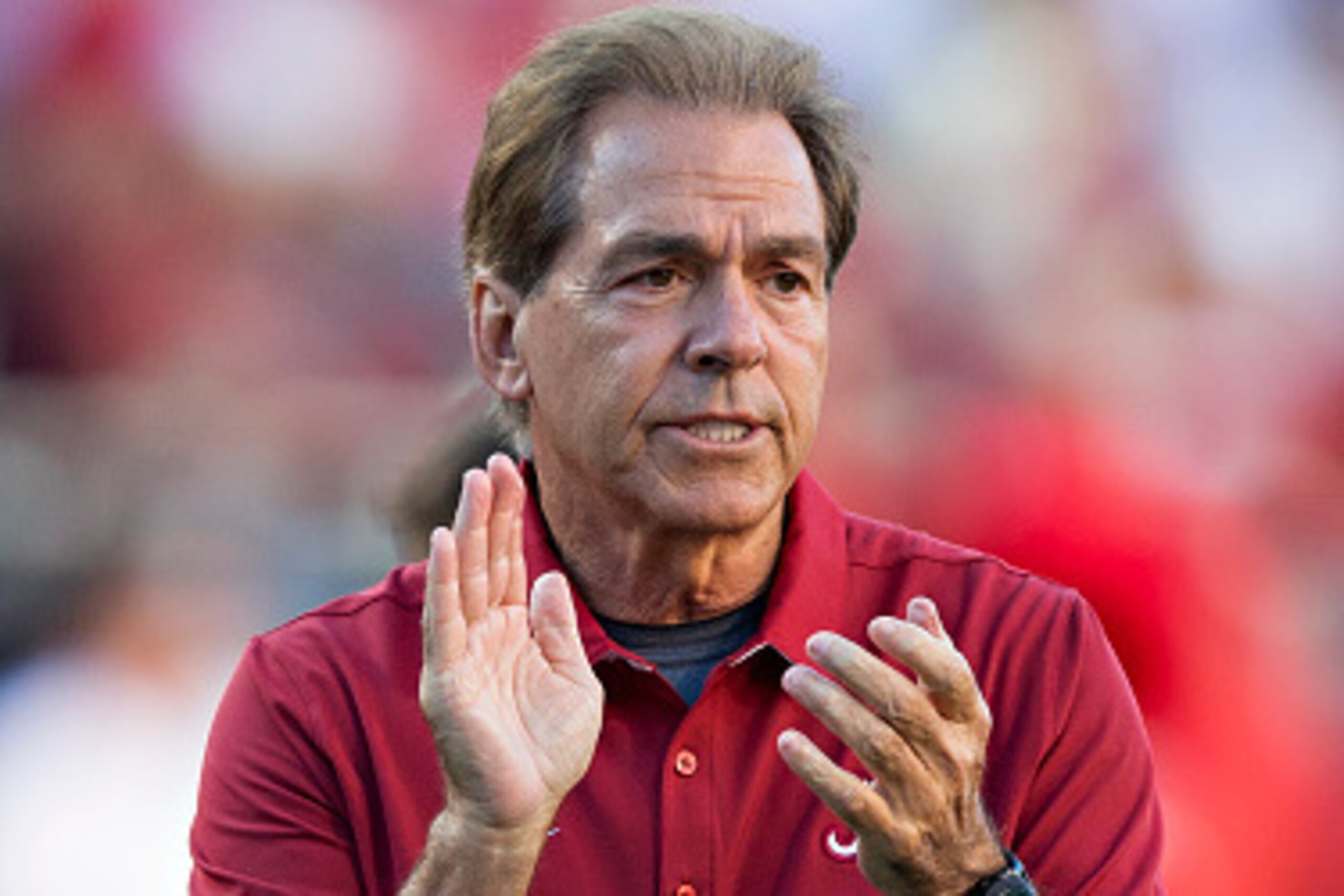FAYETTEVILLE, AR - OCTOBER 8: Head Coach Nick Saban of the Alabama Crimson Tide watches the team warm up before a game against the Arkansas Razorbacks at Razorback Stadium on October 8, 2016 in Fayetteville, Arkansas. The Crimson Tide defeated the Razor FAYETTEVILLE, AR - OCTOBER 8: Head Coach Nick Saban of the Alabama Crimson Tide watches the team warm up before a game against the Arkansas Razorbacks at Razorback Stadium on October 8, 2016 in Fayetteville, Arkansas. The Crimson Tide defeated the Razor
