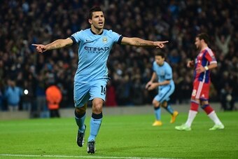 Manchester City's Argentinian striker Sergio Aguero celebrates scoring the opening goal from a penalty kick during the UEFA Champions League Group E football match between Manchester City and Bayern Munich at the Etihad Stadium in Manchester, northwest En
