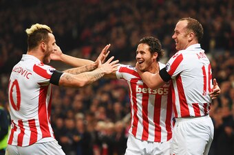 STOKE ON TRENT, ENGLAND - OCTOBER 31:  (L-R) Marko Arnautovic, Ramadan Sobhi and Charlie Adam of Stoke City celebrate as Alfie Mawson of Swansea City (not pictured) scores an own goal for their second goal during the Premier League match between Stoke Cit