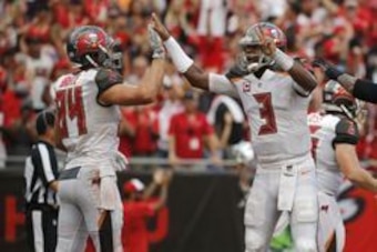 Sep 25, 2016; Tampa, FL, USA; Tampa Bay Buccaneers tight end Cameron Brate (84) is congratulated by  quarterback Jameis Winston (3) after he scored a touchdown against the Los Angeles Rams during the second half at Raymond James Stadium. Mandatory Credit: