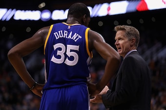 PHOENIX, AZ - OCTOBER 30:  Head coach Steve Kerr of the Golden State Warriors talks with Kevin Durant #35 during the second half of the NBA game against the Phoenix Suns at Talking Stick Resort Arena on October 30, 2016 in Phoenix, Arizona.  The Warriors 