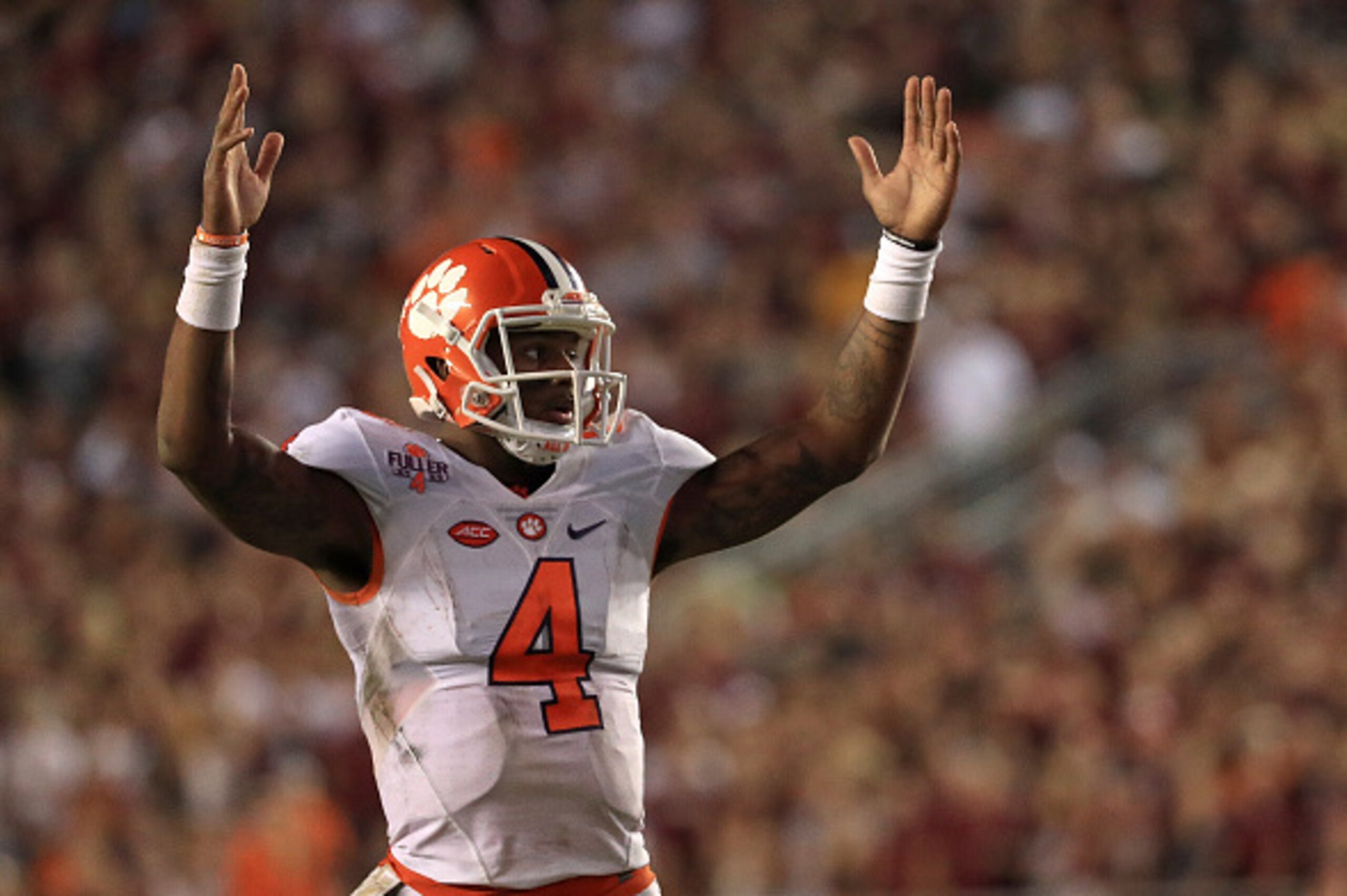 TALLAHASSEE, FL - OCTOBER 29:  Deshaun Watson #4 of the Clemson Tigers celebrates a touchdown during a game against the Florida State Seminoles at Doak Campbell Stadium on October 29, 2016 in Tallahassee, Florida.  (Photo by Mike Ehrmann/Getty Images)