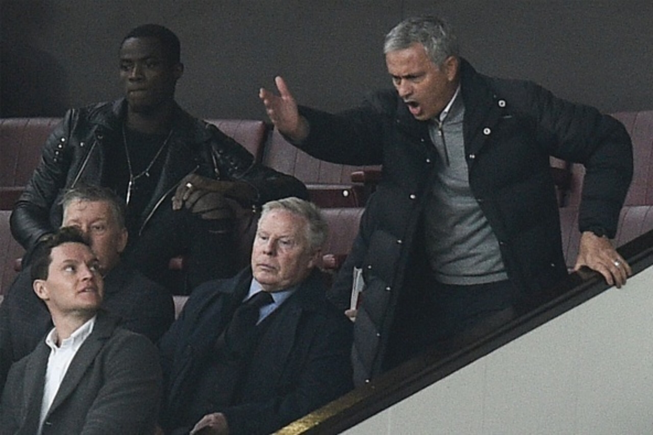 Manchester United's Portuguese manager Jose Mourinho (R) gestures and shouts in the Directors Box after being sent off to the stands during the English Premier League football match between Manchester United and Burnley at Old Trafford in Manchester, nort