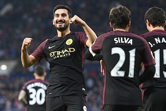 Manchester City's German midfielder Ilkay Gundogan (L) celebrates after scoring their third goal during the English Premier League football match between West Bromwich Albion and Manchester City at The Hawthorns stadium in West Bromwich, central England, 