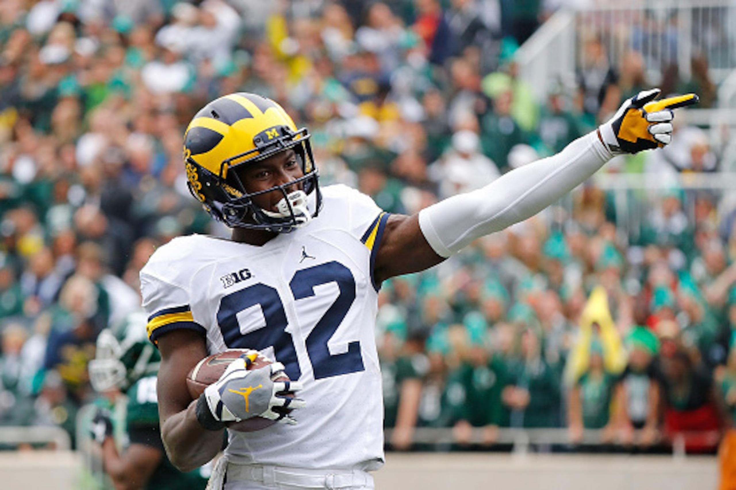EAST LANSING, MI - OCTOBER 29: Amara Darboh #82 of the Michigan Wolverines signals a first down after making a catch during the second quarter of the game against the Michigan State Spartans at Spartan Stadium on October 29, 2016 in East Lansing, Michigan