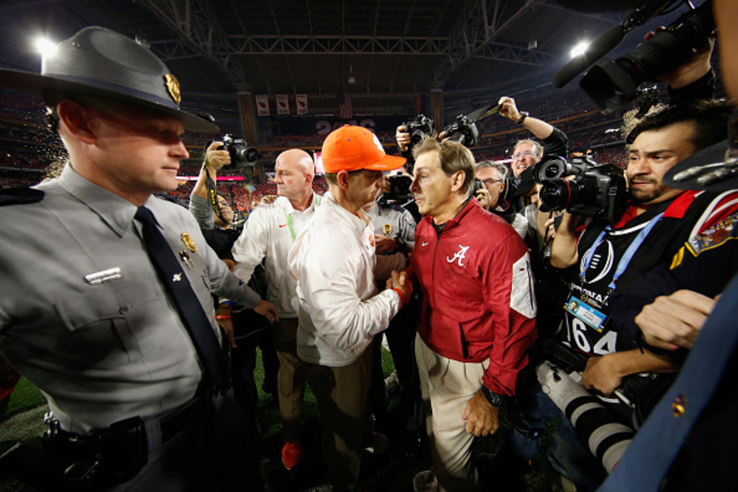 GLENDALE, AZ - JANUARY 11:  Head coach Nick Saban of the Alabama Crimson Tide shakes hands with head coach Dabo Swinney of the Clemson Tigers after the 2016 College Football Playoff National Championship Game at University of Phoenix Stadium on January 11