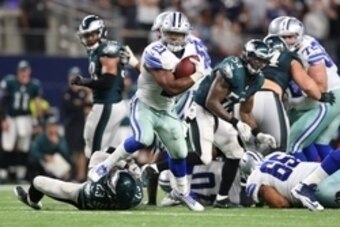 Oct 30, 2016; Arlington, TX, USA; Dallas Cowboys running back Ezekiel Elliott (21) runs with the ball in overtime against Philadelphia Eagles safety Rodney McLeod (23) at AT&T Stadium. The Cowboys beat the Eagles 29-23 in overtime. Mandatory Credit: Matth