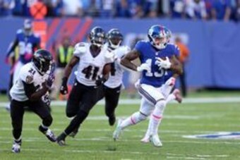 Oct 16, 2016; East Rutherford, NJ, USA; New York Giants wide receiver Odell Beckham Jr. (13) runs past Baltimore Ravens defensive back Anthony Levine (41) for a touchdown during the fourth quarter at MetLife Stadium. Mandatory Credit: Brad Penner-USA TODA