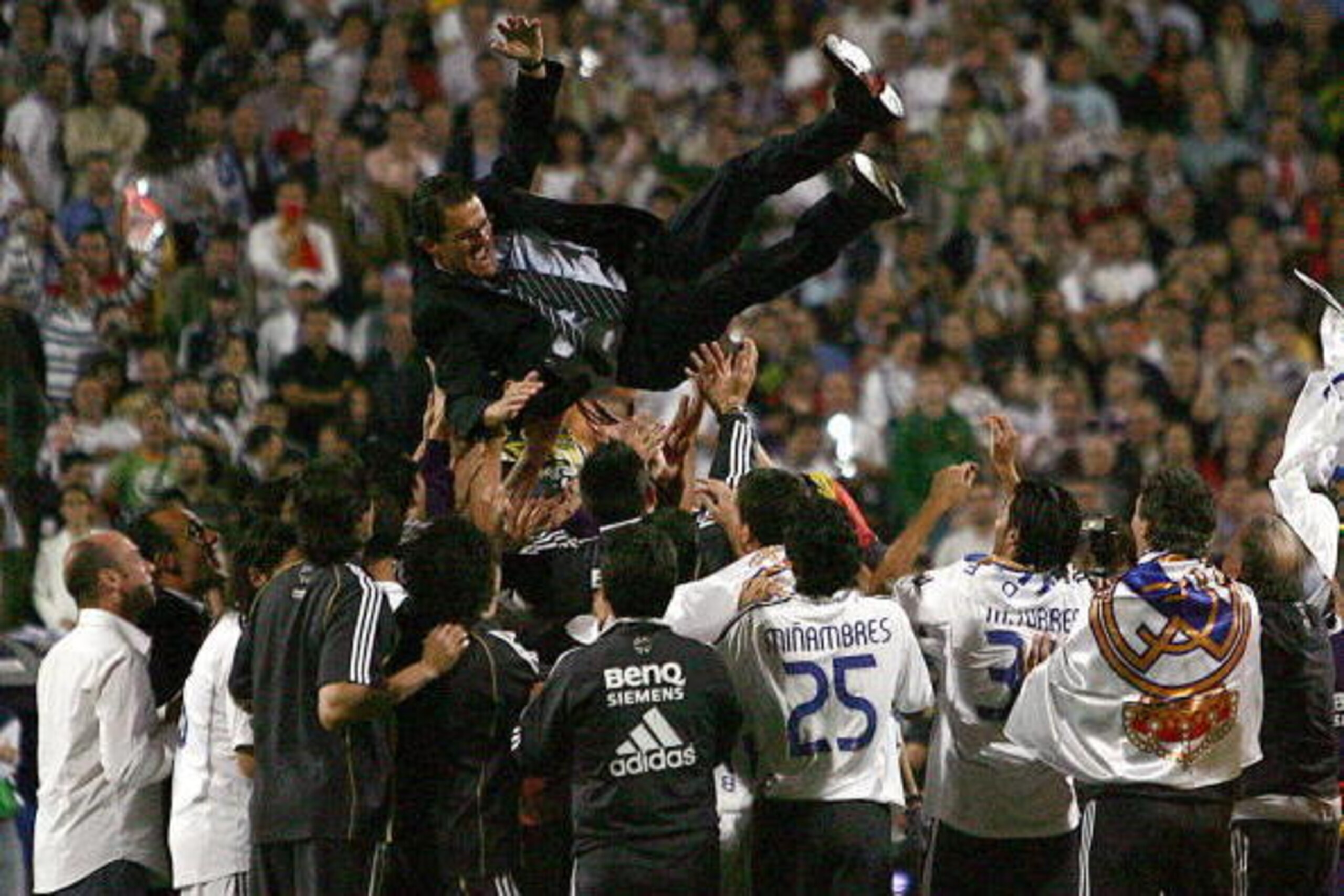 Madrid, SPAIN: Real Madrid's Italian coach Fabio Capello is thrown in the air after Real won the Spanish league title by beating Mallorca in the final Spanish league football match of the season, 17 June 2007 at the Santiago Bernabeu stadium in Madrid. Re Madrid, SPAIN: Real Madrid's Italian coach Fabio Capello is thrown in the air after Real won the Spanish league title by beating Mallorca in the final Spanish league football match of the season, 17 June 2007 at the Santiago Bernabeu stadium in Madrid. Re