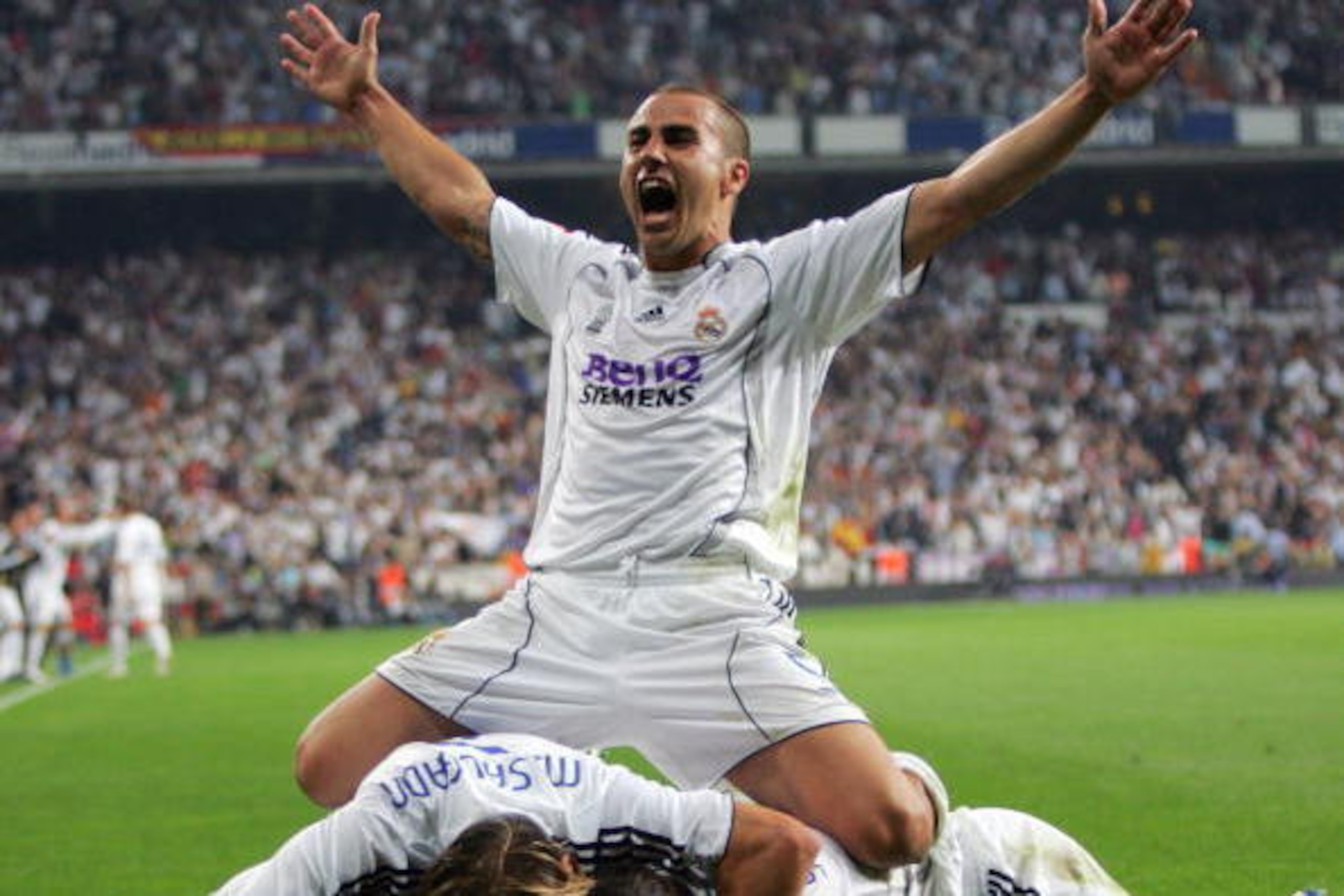 --- EDITORS NOTE --- BEST PICTURES FROM SPAIN IN 2007 MORE IN IMAGEFORUM Real Madrid's Malian midfielder Mahamadou Diarra (not visible) is engulfed by his teammates, most notably Fabio Cannavaro (arms outstretched), after scoring Real's second goal agains --- EDITORS NOTE --- BEST PICTURES FROM SPAIN IN 2007 MORE IN IMAGEFORUM Real Madrid's Malian midfielder Mahamadou Diarra (not visible) is engulfed by his teammates, most notably Fabio Cannavaro (arms outstretched), after scoring Real's second goal agains