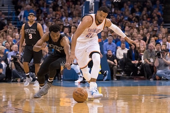 OKLAHOMA CITY, OK - OCTOBER 28: T.J. Warren #12 of the Phoenix Suns and Andre Roberson #21 of the Oklahoma City Thunder battle for the ball during the first half of a NBA game at the Chesapeake Energy Arena on October 28, 2016 in Oklahoma City, Oklahoma. 