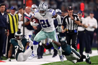 ARLINGTON, TX - OCTOBER 30:  Ezekiel Elliott #21 of the Dallas Cowboys runs the ball against Rodney McLeod #23 of the Philadelphia Eagles in the second quarter during a game between the Dallas Cowboys and the Philadelphia Eagles at AT&T Stadium on October