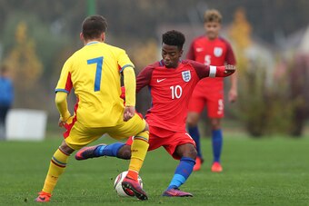 BUFTEA, ROMANIA - OCTOBER 27: Angel Gomes (R) of England and Alexandru Gologan (L) of Romania vie during the UEFA Under-17 EURO Qualifier between U17 England and U17 Romania at Football Centre FRF on October 27, 2016 in Buftea, Romania. (Photo by Ronny Ha