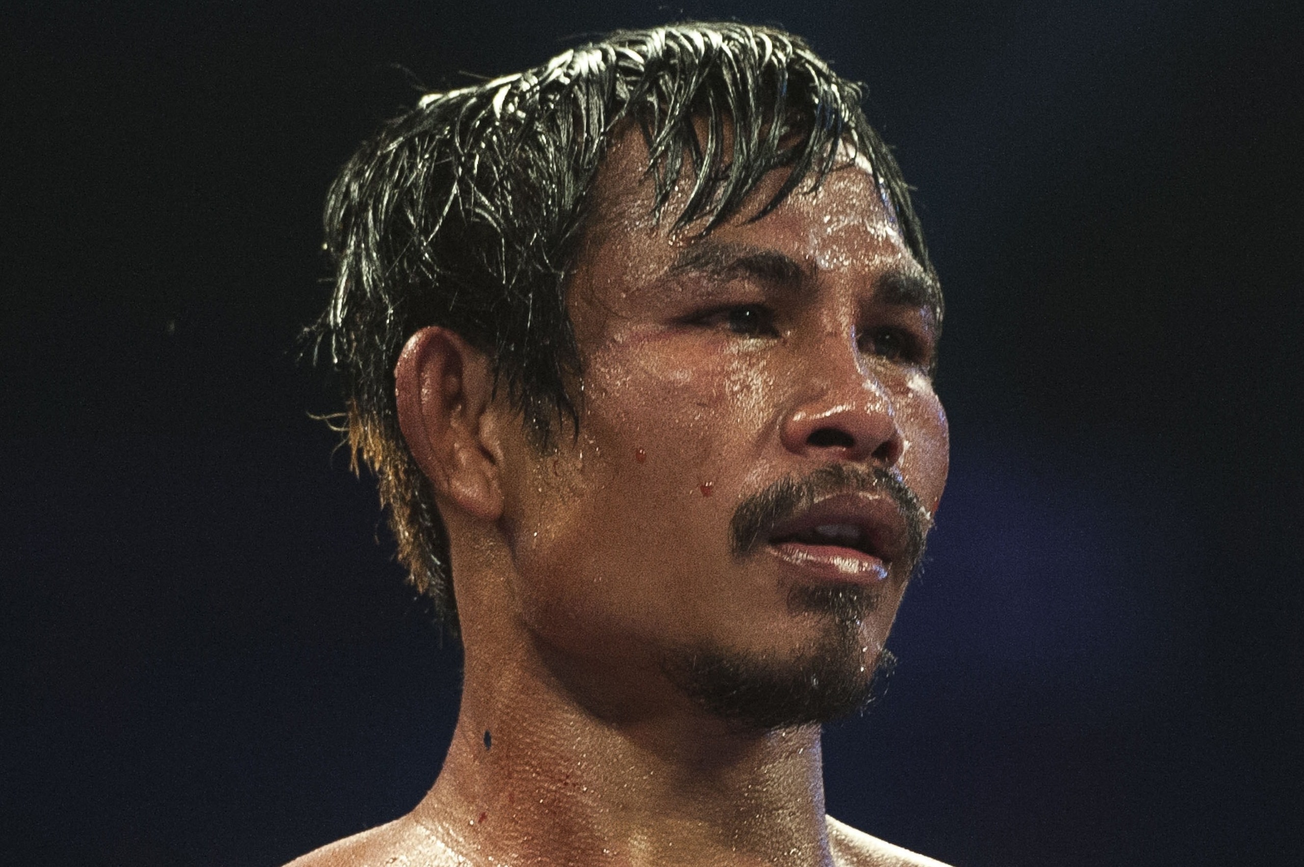 Kwanpichit Onesongchaigym of Thailand looks on during his flyweight boxing bout against Zou Shiming of China at the Cotai Arena in Macau on November 23, 2014. AFP PHOTO / XAUME OLLEROS        (Photo credit should read XAUME OLLEROS/AFP/Getty Images)