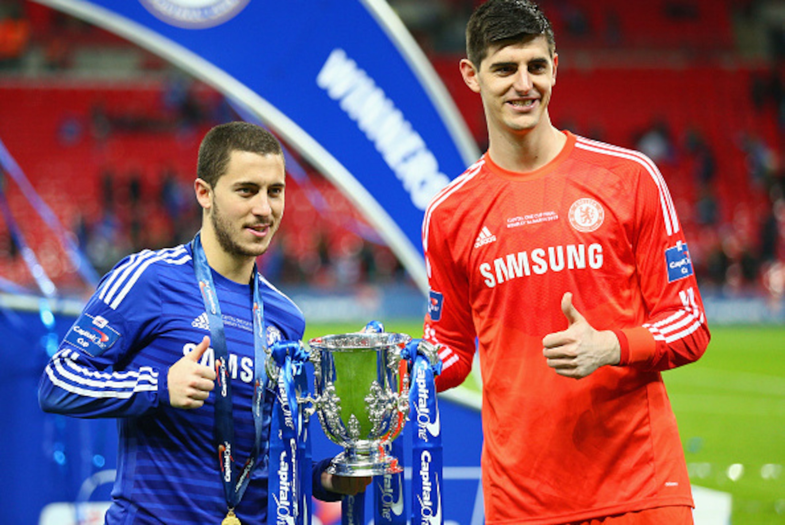 LONDON, ENGLAND - MARCH 01: Eden Hazard and Thibaut Courtois of Chelsea pose with the trophy during the Capital One Cup Final match between Chelsea and Tottenham Hotspur at Wembley Stadium on March 1, 2015 in London, England. (Photo by Clive Mason/Getty LONDON, ENGLAND - MARCH 01: Eden Hazard and Thibaut Courtois of Chelsea pose with the trophy during the Capital One Cup Final match between Chelsea and Tottenham Hotspur at Wembley Stadium on March 1, 2015 in London, England. (Photo by Clive Mason/Getty