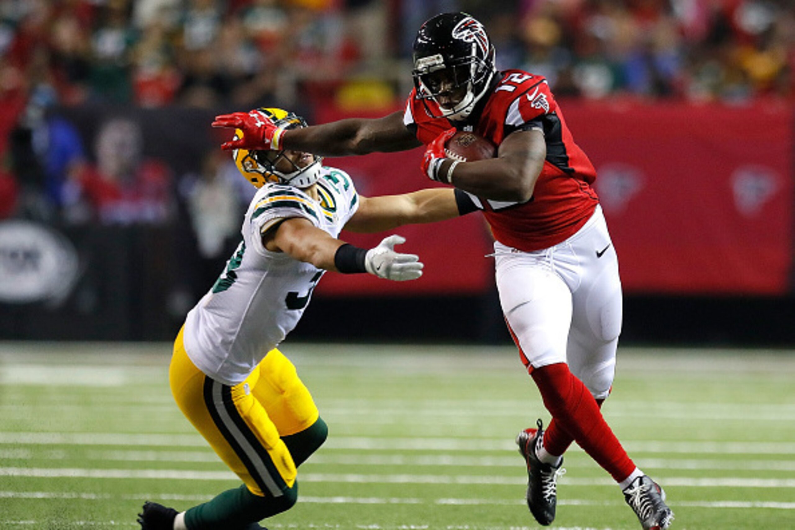 ATLANTA, GA - OCTOBER 30: Mohamed Sanu #12 of the Atlanta Falcons attempts to break a tackle by Micah Hyde #33 of the Green Bay Packers at Georgia Dome on October 30, 2016 in Atlanta, Georgia. (Photo by Kevin C. Cox/Getty Images) ATLANTA, GA - OCTOBER 30: Mohamed Sanu #12 of the Atlanta Falcons attempts to break a tackle by Micah Hyde #33 of the Green Bay Packers at Georgia Dome on October 30, 2016 in Atlanta, Georgia. (Photo by Kevin C. Cox/Getty Images)