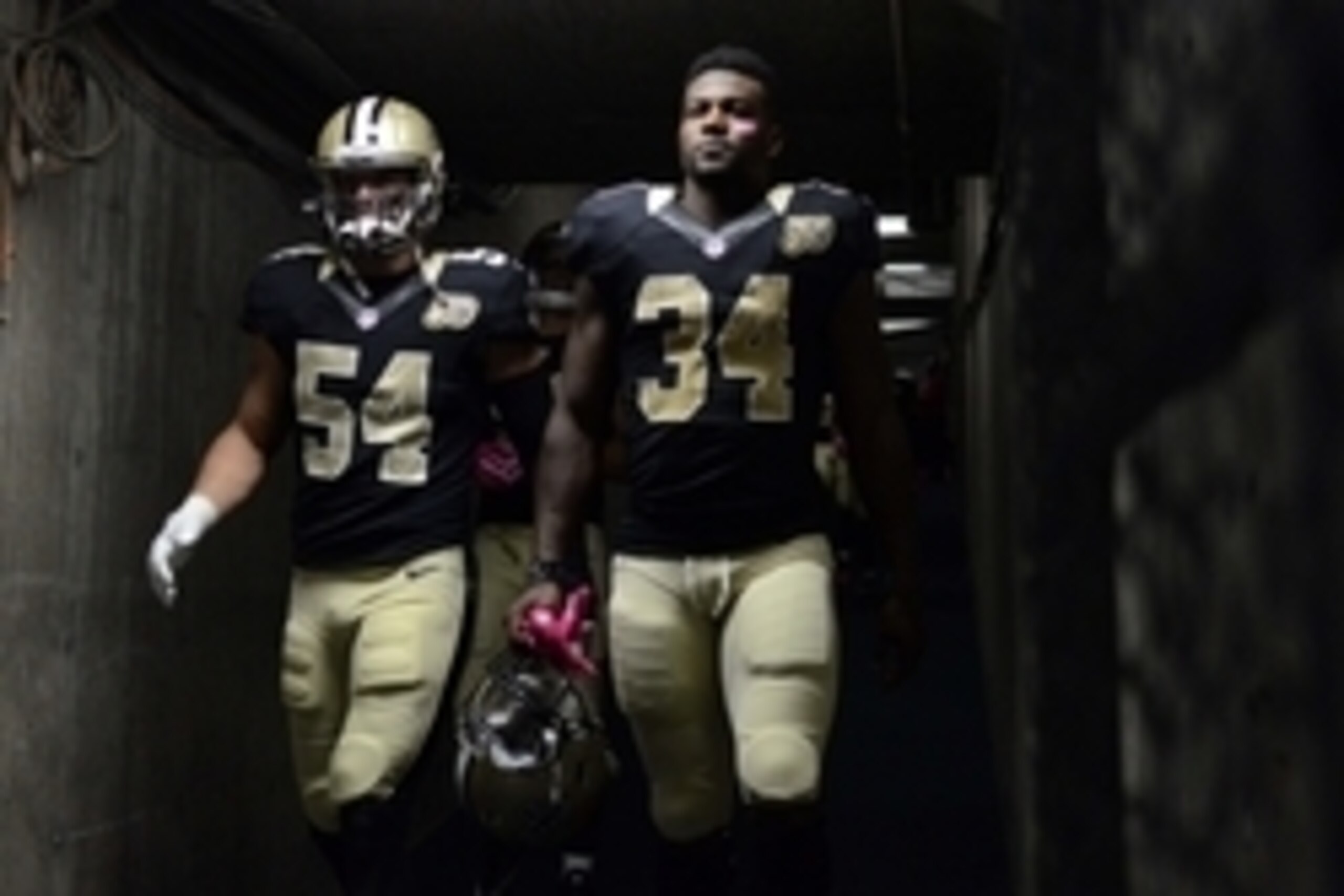 Oct 2, 2016; San Diego, CA, USA; New Orleans Saints inside linebacker Nate Stupar (54) and running back Tim Hightower (34) walk out of the tunnel before the game against the San Diego Chargers at Qualcomm Stadium. Mandatory Credit: Jake Roth-USA TODAY Spo