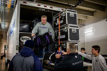 Jerry Bolling helps load an equipment truck for a Ravens road trip.