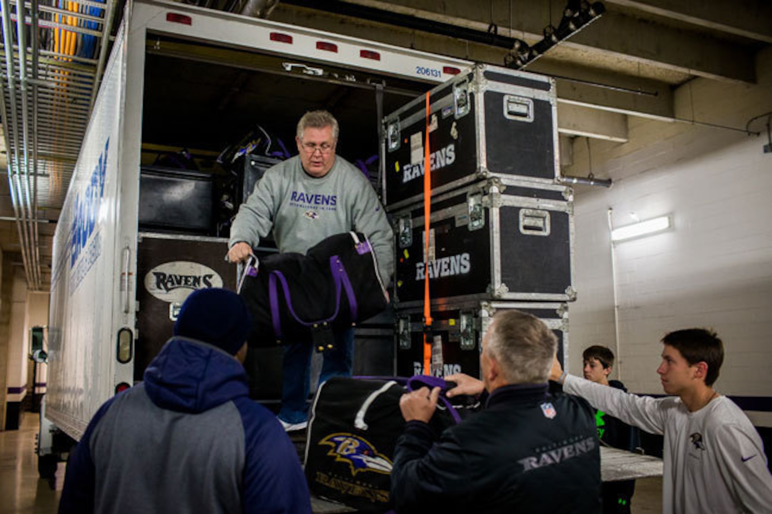 Jerry Bolling helps load an equipment truck for a Ravens road trip.