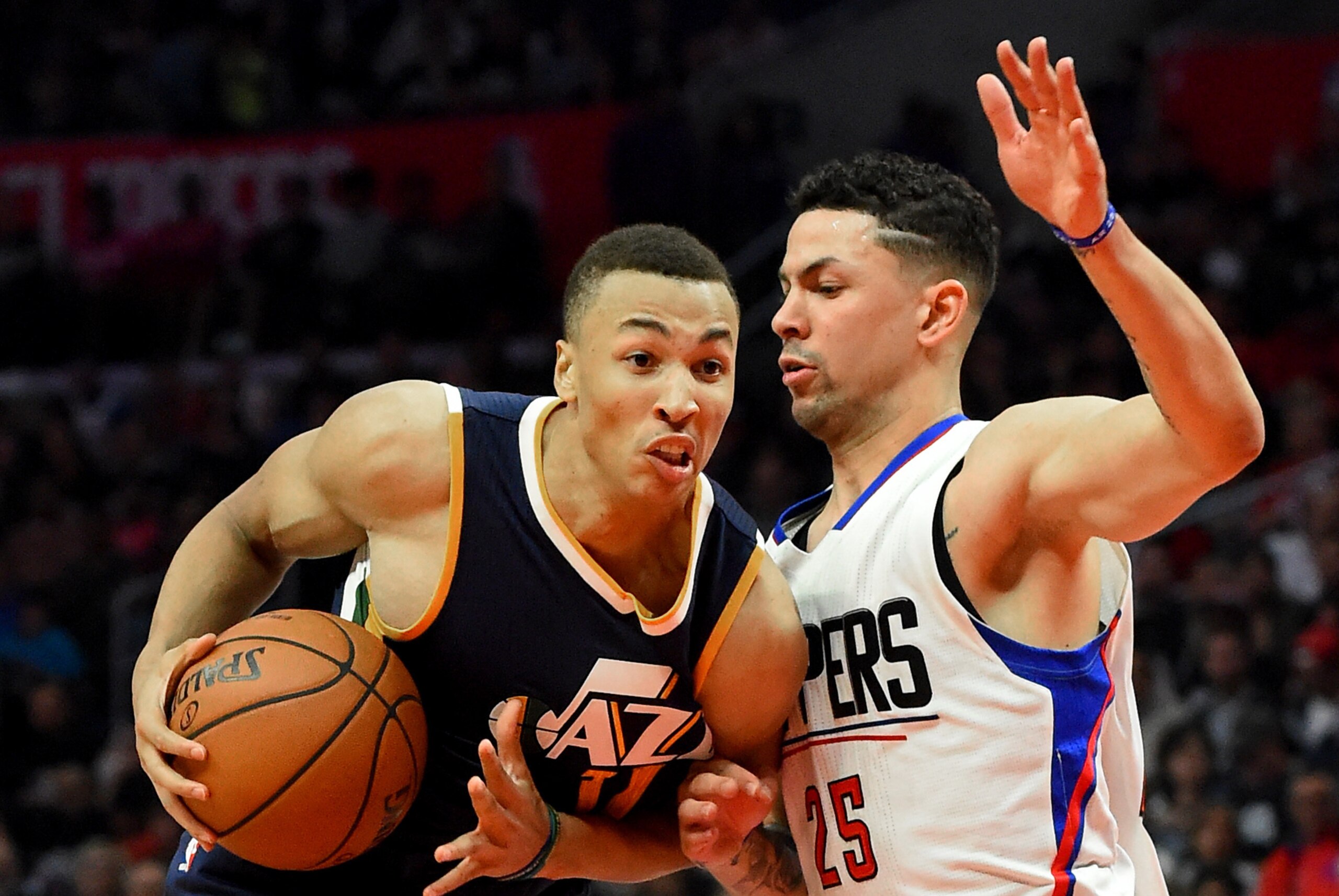 Oct 30, 2016; Los Angeles, CA, USA;  Utah Jazz guard Dante Exum (11)  drives to the basket defended by Los Angeles Clippers guard Austin Rivers (25) in the second half of the game at Staples Center. Clippers won 88-75. Mandatory Credit: Jayne Kamin-Oncea-