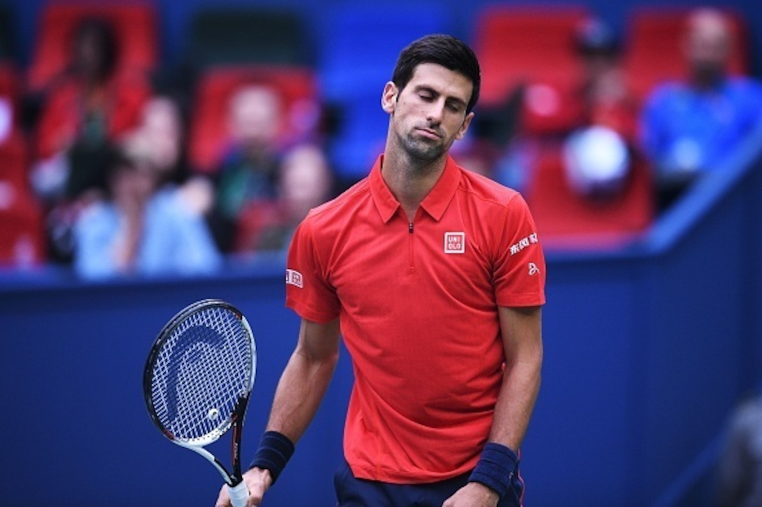 Novak Djokovic of Serbia reacts after a missed return against Mischa Zverev of Germany during their men's singles match at the Shanghai Masters tennis tournament on October 14, 2016. / AFP / JOHANNES EISELE (Photo credit should read JOHANNES EISELE Novak Djokovic of Serbia reacts after a missed return against Mischa Zverev of Germany during their men's singles match at the Shanghai Masters tennis tournament on October 14, 2016. / AFP / JOHANNES EISELE (Photo credit should read JOHANNES EISELE