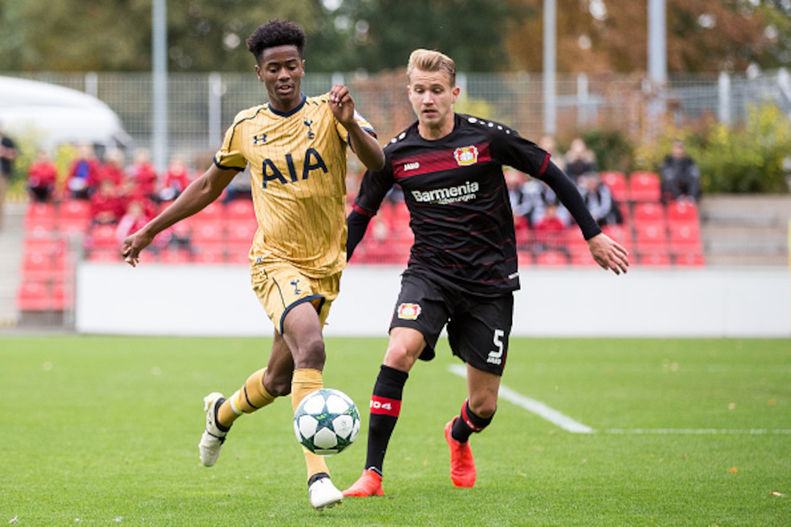 LEVERKUSEN, GERMANY - OCTOBER 18: Lukas Boeder (R) of Leverkusen battles for the ball with Shayon Harrison of Tottenham during the UEFA Youth Champions League match between Bayer Leverkusen and Tottenham Hotspur FC at Ulrich Haberland Stadion on October 1 LEVERKUSEN, GERMANY - OCTOBER 18: Lukas Boeder (R) of Leverkusen battles for the ball with Shayon Harrison of Tottenham during the UEFA Youth Champions League match between Bayer Leverkusen and Tottenham Hotspur FC at Ulrich Haberland Stadion on October 1