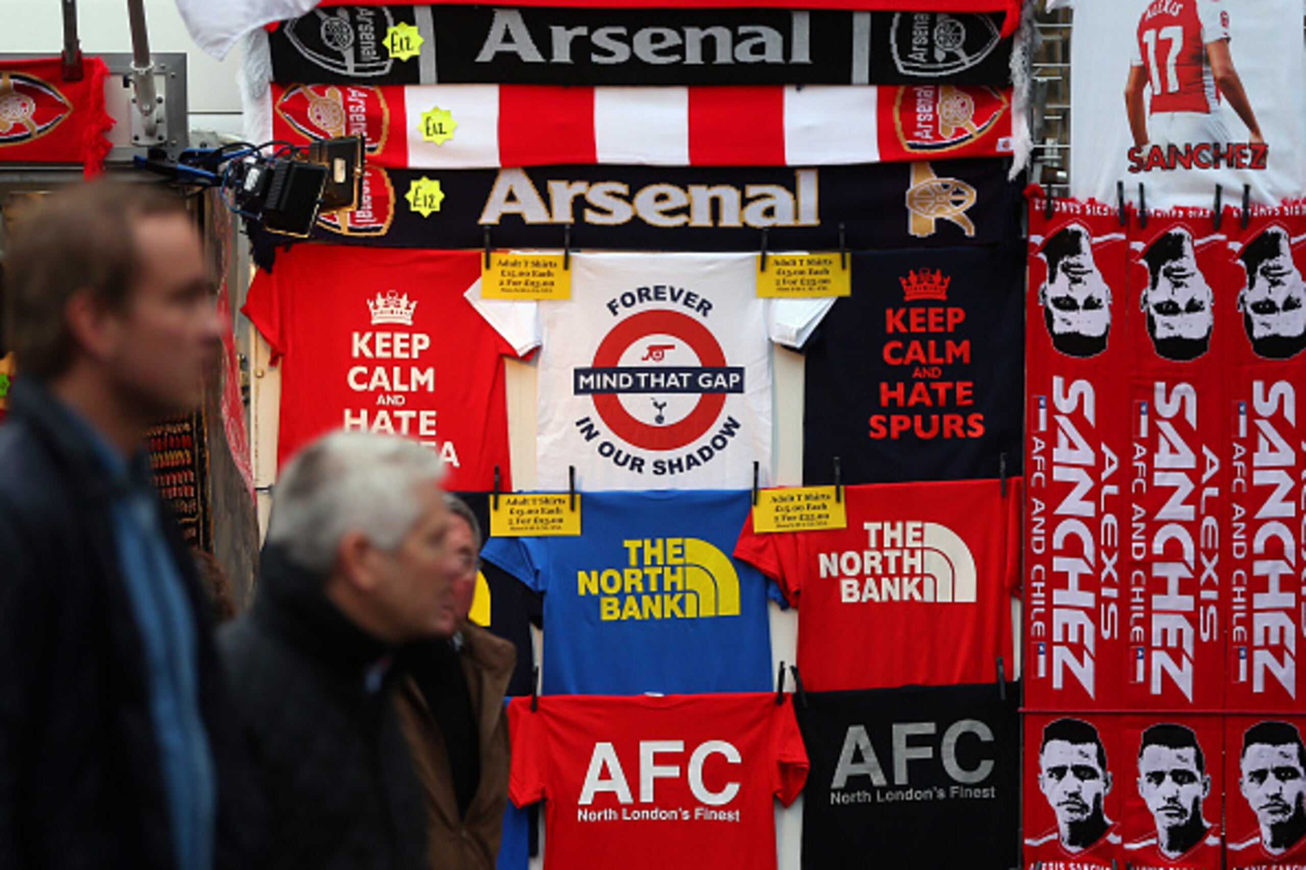 LONDON, ENGLAND - NOVEMBER 08:  T-shirts for sale depicting the rivalry between Arsenal and Tottenham Hotspur before the Barclays Premier League match between Arsenal and Tottenham Hotspur at Emirates Stadium on November 8, 2015 in London, England.  (Phot