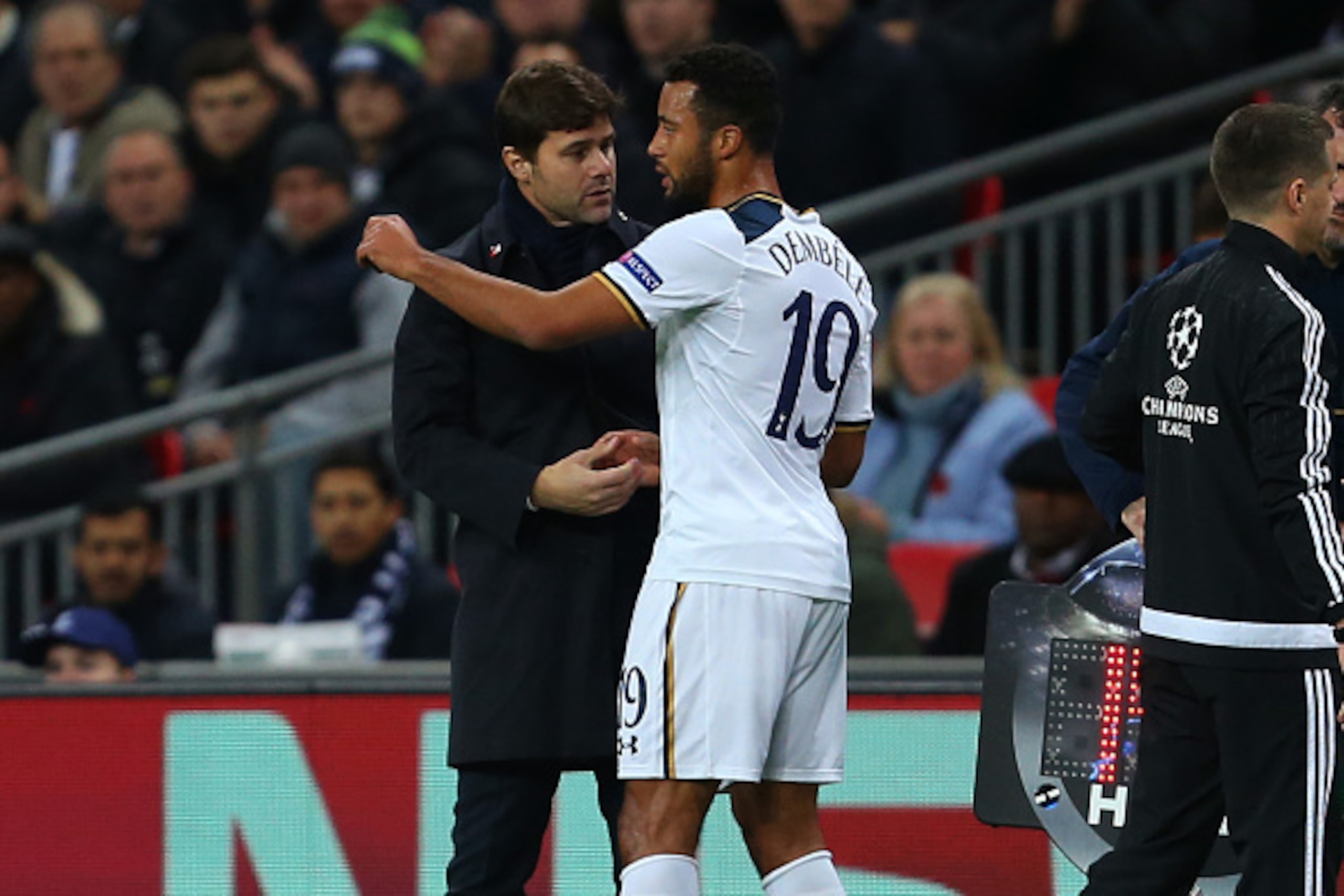 LONDON, ENGLAND - NOVEMBER 02: Mauricio Pochettino manager / head coach of Tottenham Hotspur speaks with Mousa Dembele of Tottenham Hotspur after he is substituted in the first half of the UEFA Champions League match between Tottenham Hotspur FC and Bayer