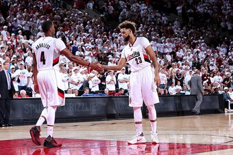PORTLAND, OR - APRIL 23: Allen Crabbe #23 and Maurice Harkless #4 of the Portland Trail Blazers high five each other during the game against the Los Angeles Clippers in Game Three of the Western Conference Quarterfinals during the 2016 NBA Playoffs on Apr