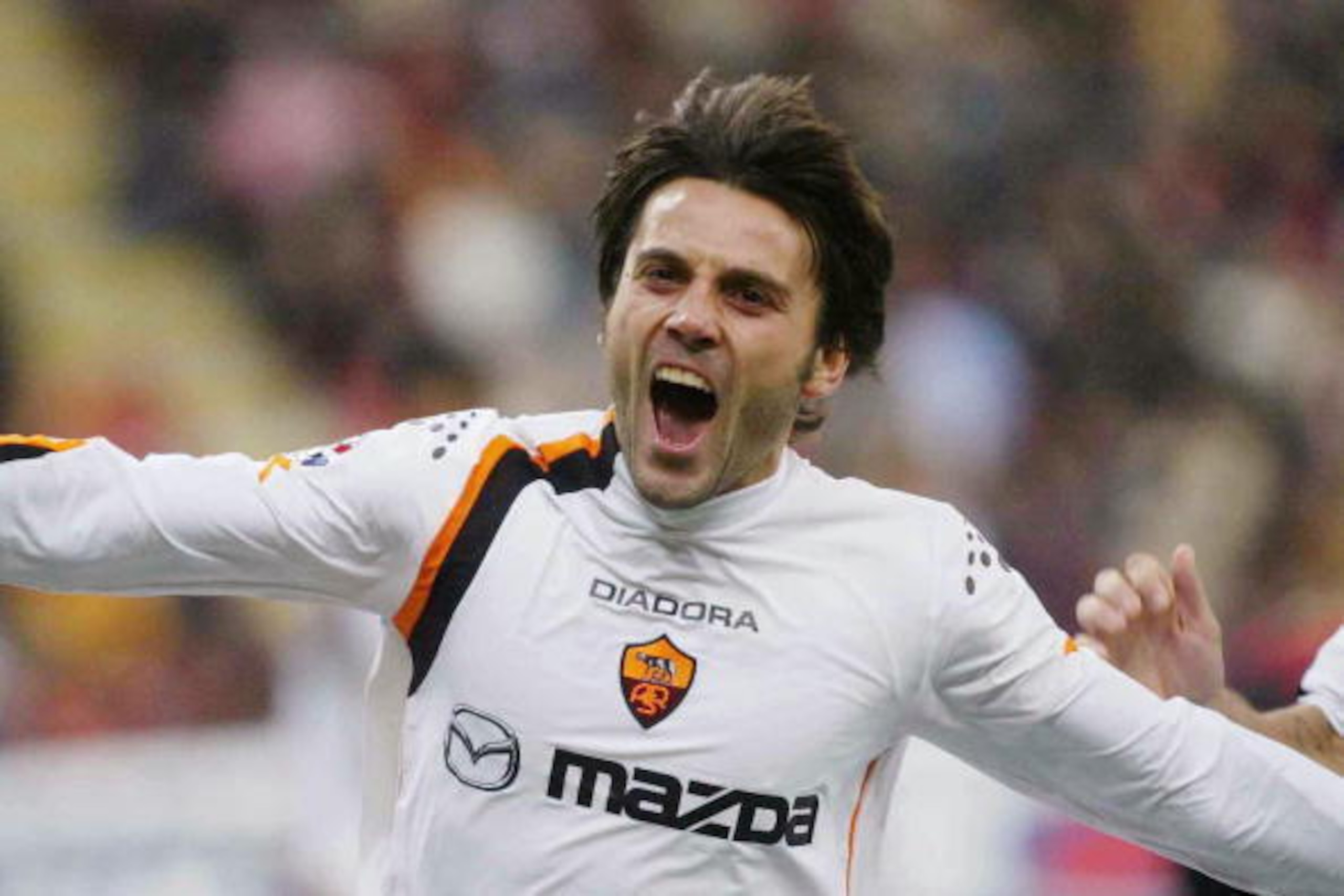 MILAN, ITALY - NOVEMBER 7:  Vincenzo Montella of Roma celebrates after a goal against AC Milan during the Serie A match played at the San Siro Stadium November 7, 2004 in Milan, Italy.  (Photo by Newpress/Getty Images)