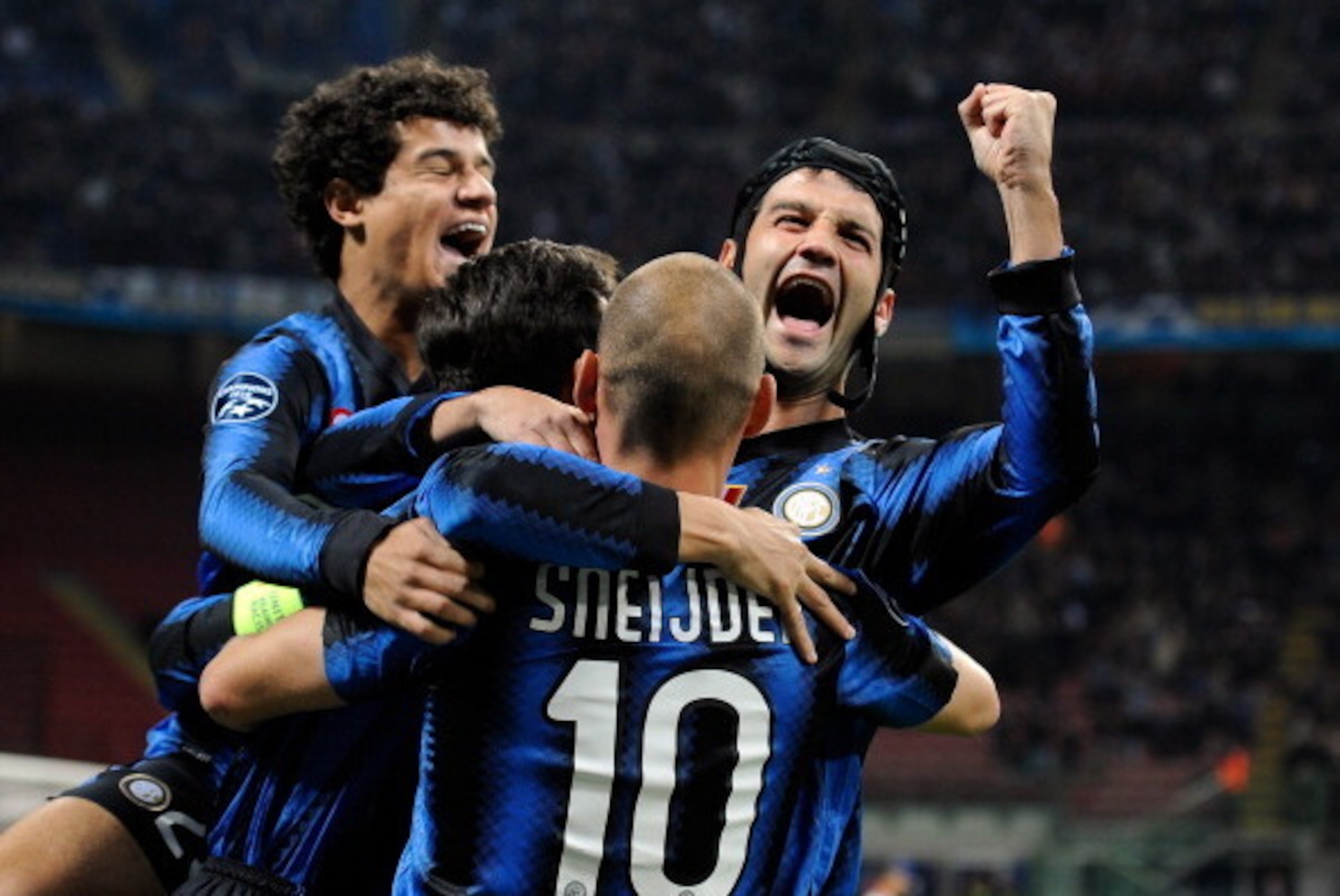 MILAN, ITALY - OCTOBER 20:  Coutinho, Cristian Chivu and Wesley Sneijder of Inter Milan celebrates after the first goal during the UEFA Champions League group A match between FC Internazionale Milano and Tottenham Hotspur at Stadio Giuseppe Meazza on Octo