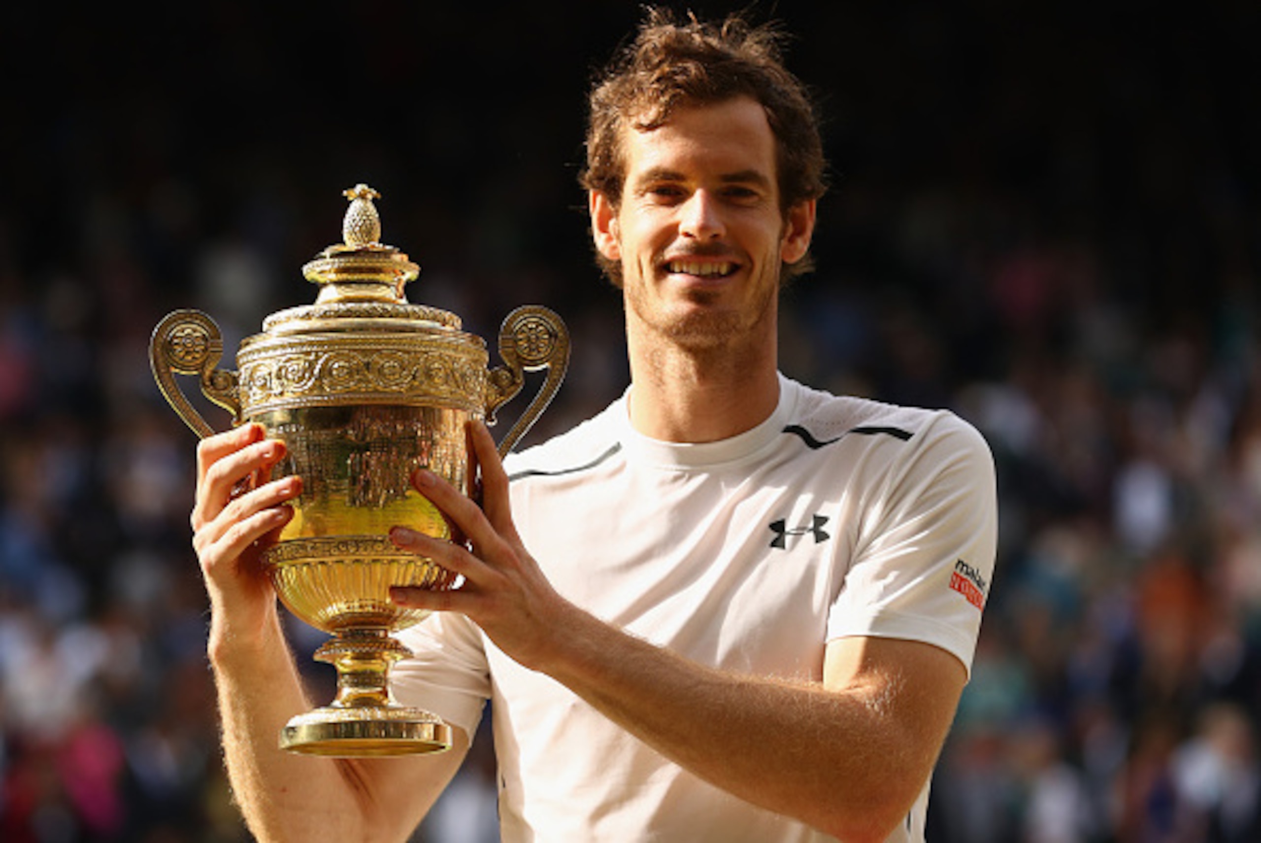 LONDON, ENGLAND - JULY 10:  Andy Murray of Great Britain lifts the trophy following victory in the Men's Singles Final against Milos Raonic of Canada on day thirteen of the Wimbledon Lawn Tennis Championships at the All England Lawn Tennis and Croquet Clu