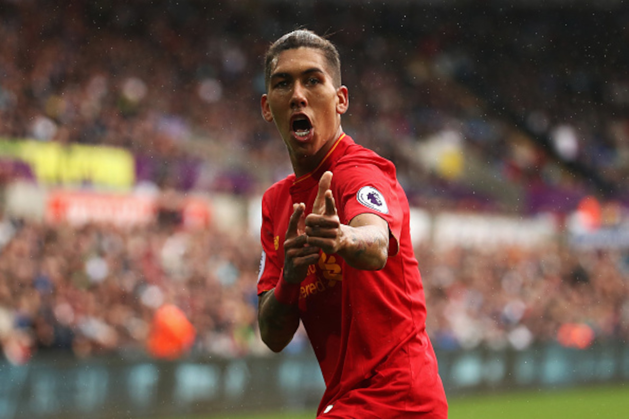 SWANSEA, WALES - OCTOBER 01: Roberto Firmino of Liverpool celebrates scoring his sides first goal during the Premier League match between Swansea City and Liverpool at Liberty Stadium on October 1, 2016 in Swansea, Wales. (Photo by Julian Finney/Getty I SWANSEA, WALES - OCTOBER 01: Roberto Firmino of Liverpool celebrates scoring his sides first goal during the Premier League match between Swansea City and Liverpool at Liberty Stadium on October 1, 2016 in Swansea, Wales. (Photo by Julian Finney/Getty I