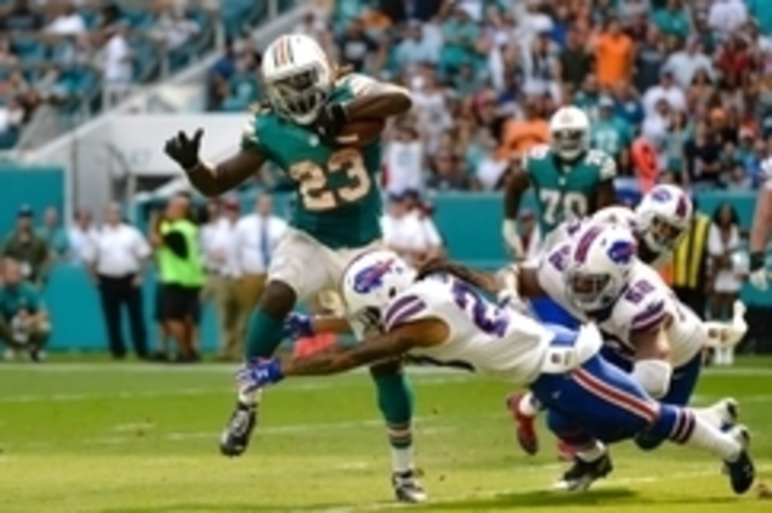 Oct 23, 2016; Miami Gardens, FL, USA; Miami Dolphins running back Jay Ajayi (23) carries the ball past Buffalo Bills inside linebacker Preston Brown (52) and Buffalo Bills cornerback Ronald Darby (28) during the second half at Hard Rock Stadium. The Dolp Oct 23, 2016; Miami Gardens, FL, USA; Miami Dolphins running back Jay Ajayi (23) carries the ball past Buffalo Bills inside linebacker Preston Brown (52) and Buffalo Bills cornerback Ronald Darby (28) during the second half at Hard Rock Stadium. The Dolp
