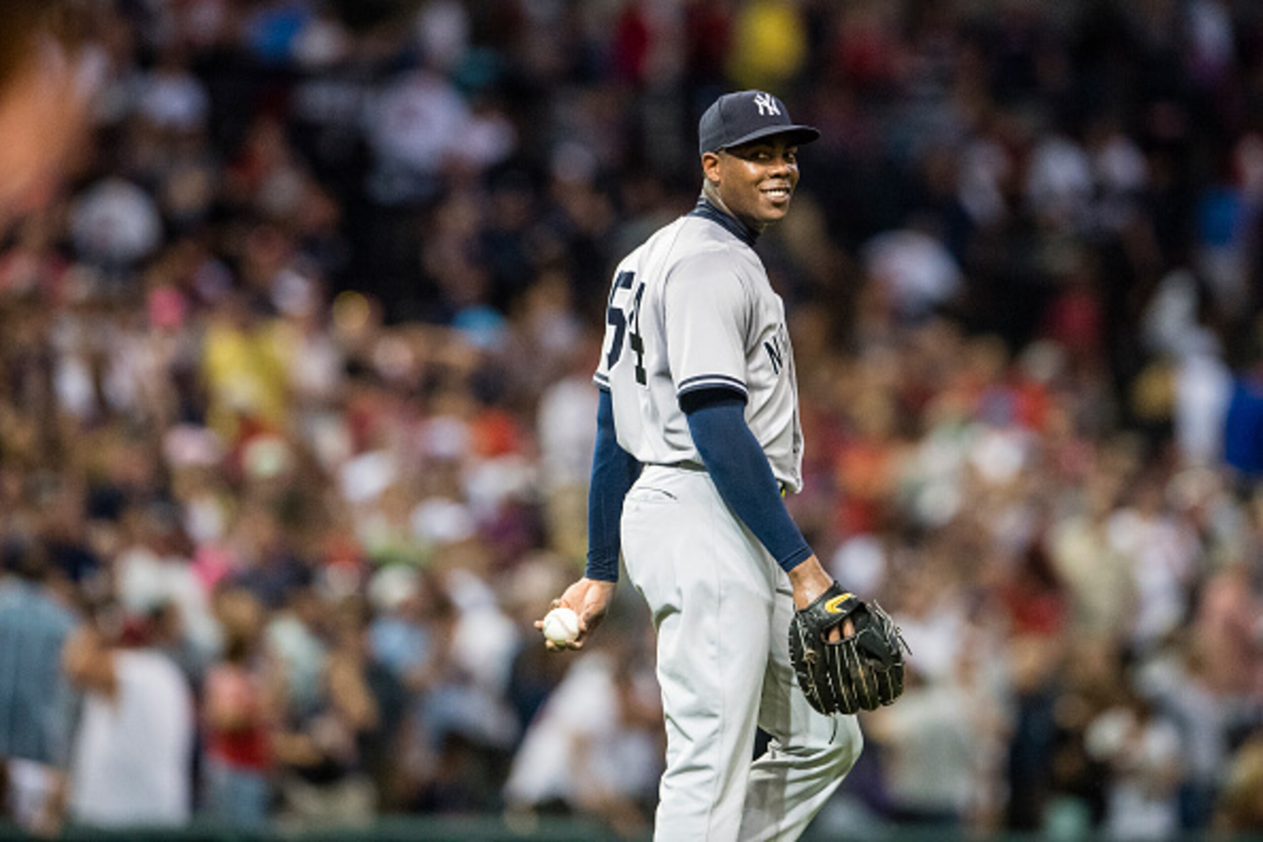 CLEVELAND, OH -  JULY 7: Closing pitcher Aroldis Chapman #54 of the New York Yankees reacts after umpires call the last out after a review to give the Yankees the 5-4 win over against the Cleveland Indians at Progressive Field on July 7, 2016 in Cleveland