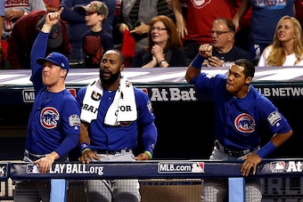 CLEVELAND, OH - NOVEMBER 01:  Jason Heyward #22 of the Chicago Cubs (C) and Addison Russell #27 (R) react after Kris Bryant #17 (not pictured) hit a solo home run during the first inning against the Cleveland Indians in Game Six of the 2016 World Series a