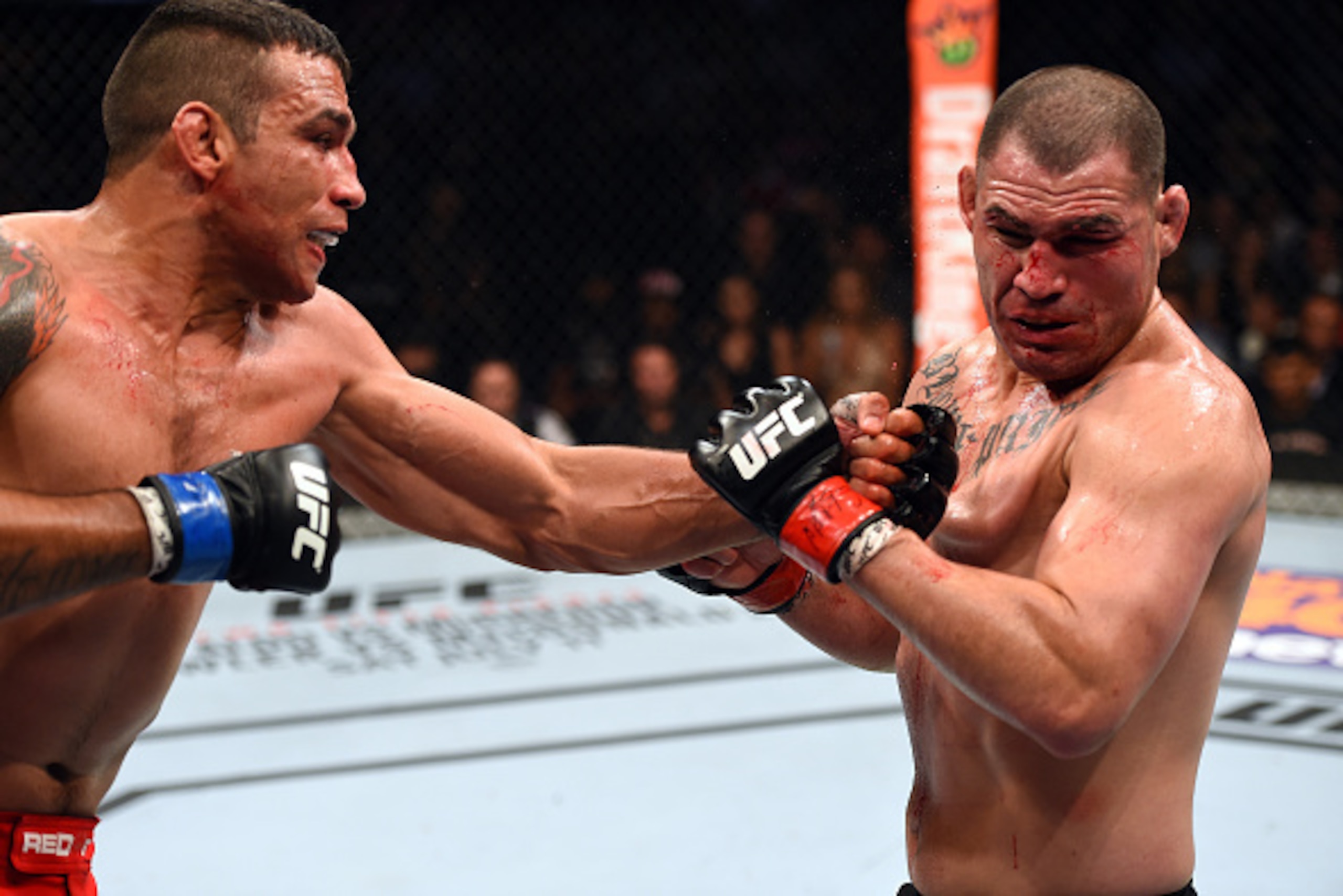 MEXICO CITY, MEXICO - JUNE 13:  (L-R) Fabricio Werdum punches Cain Velasquez in their UFC heavyweight championship bout during the UFC 188 event inside the Arena Ciudad de Mexico on June 13, 2015 in Mexico City, Mexico. (Photo by Josh Hedges/Zuffa LLC/Zuf