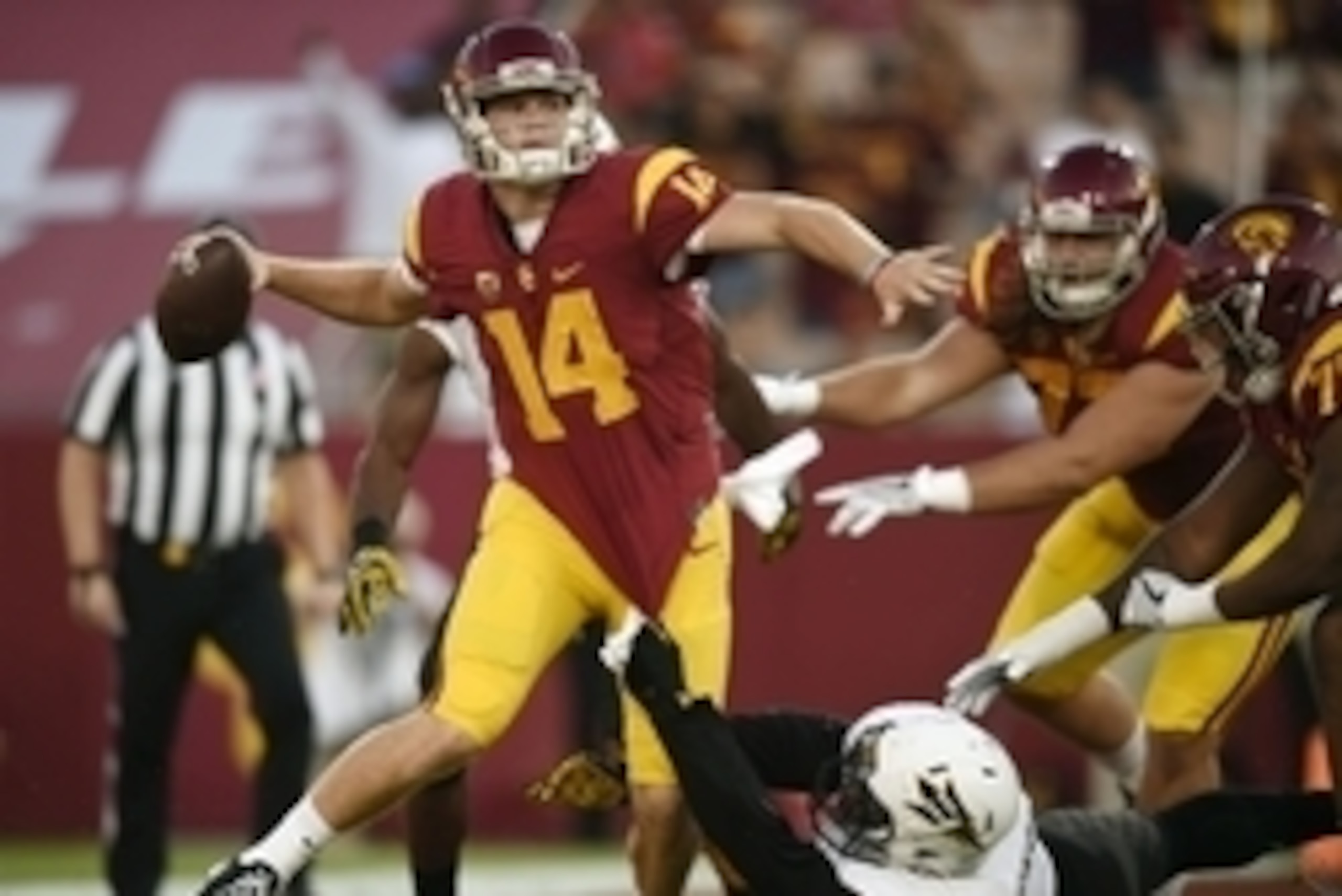 Oct 1, 2016; Los Angeles, CA, USA; Southern California Trojans quarterback Sam Darnold (14) attempts to scramble away from Arizona State Sun Devils defensive lineman JoJo Wicker (1) during the first half at Los Angeles Memorial Coliseum. Mandatory Credit: